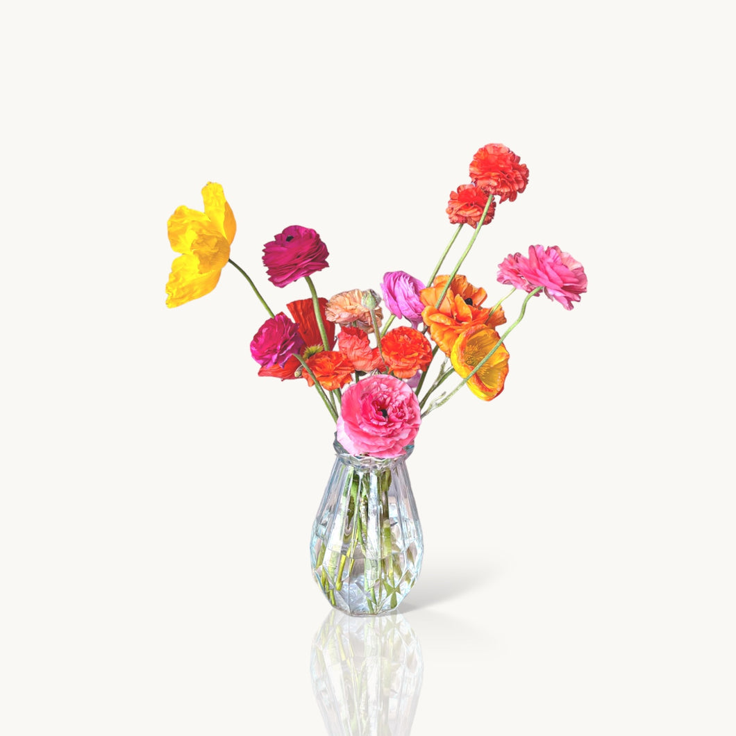 Seasonal Flowers In A Glass Vase